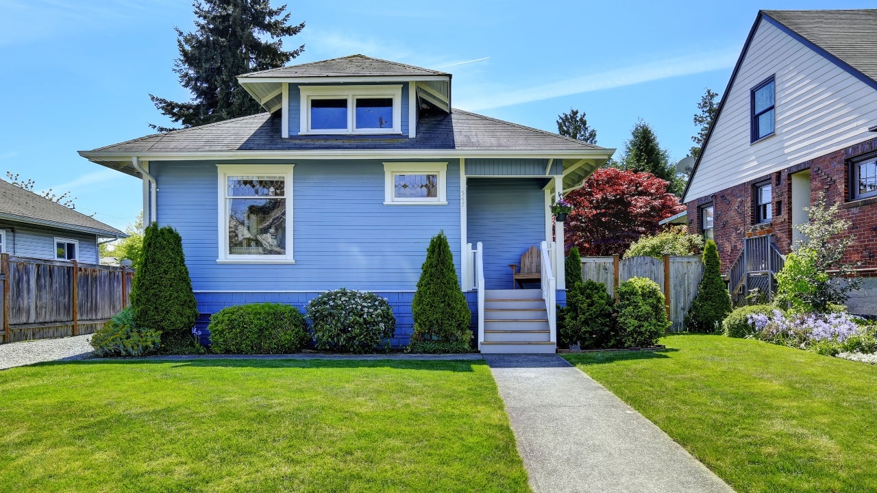 A blue Craftsman-style home