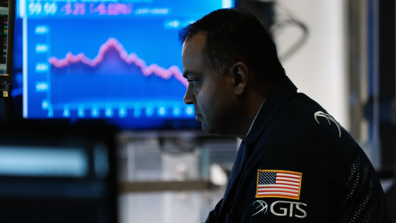 Traders work on the floor of the New York Stock Exchange