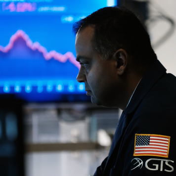 Traders work on the floor of the New York Stock Exchange