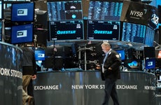 A trader walks the floor of the New York Stock Exchange