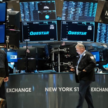 A trader walks the floor of the New York Stock Exchange