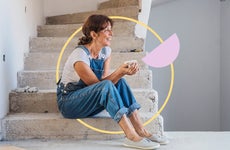 Image of a woman sitting on stairs with illustrated graphics behind her
