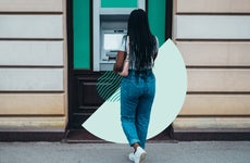 Woman walking up to an ATM