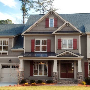 A gray accented suburban home with a double garage
