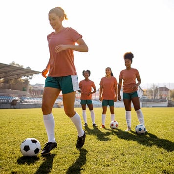 college aged woman playing soccer