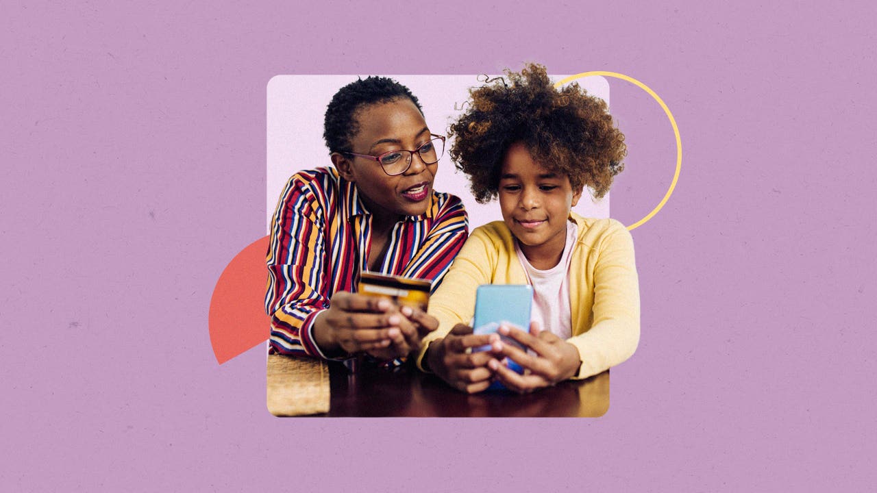 Mother and daughter looking at savings account info on a cellphone