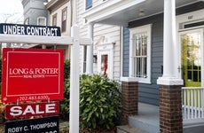 Under contract sign in front of a home