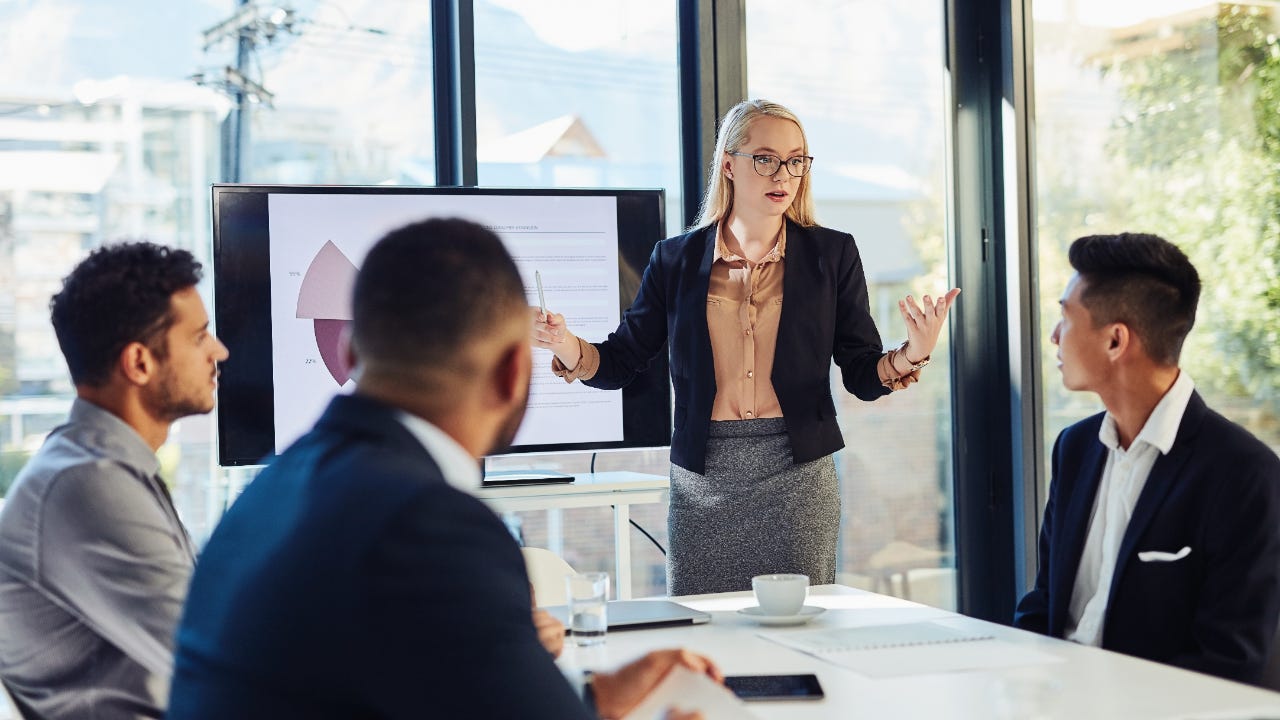 A group of professional investors meet in an office