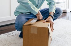 Man Opens Package After Delivery of Online Order