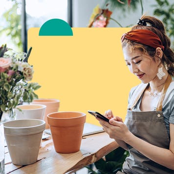 Small business owner using cell phone