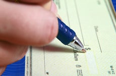 Filling in a blank check with a pen