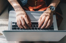 Image of person on laptop from above