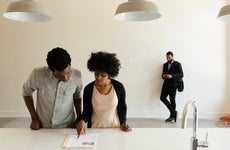 Couple looking over documentation