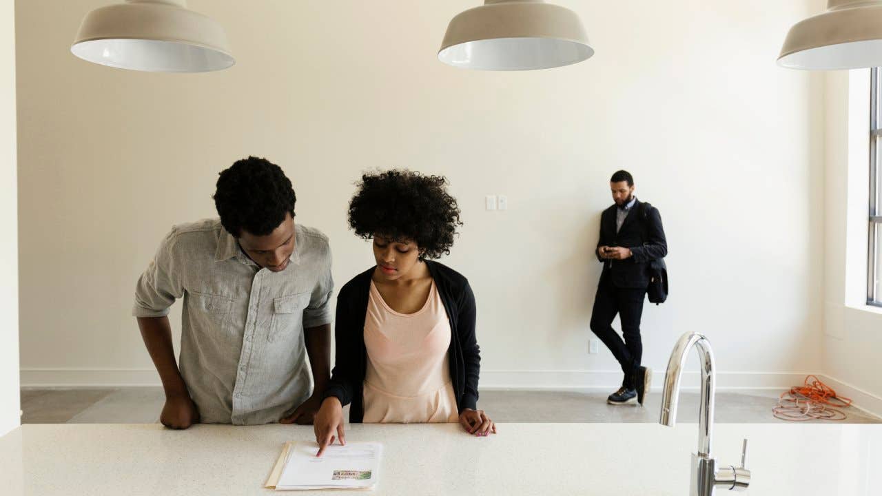 Couple looking over documentation