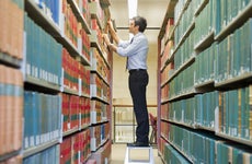 Person searching through a library of files