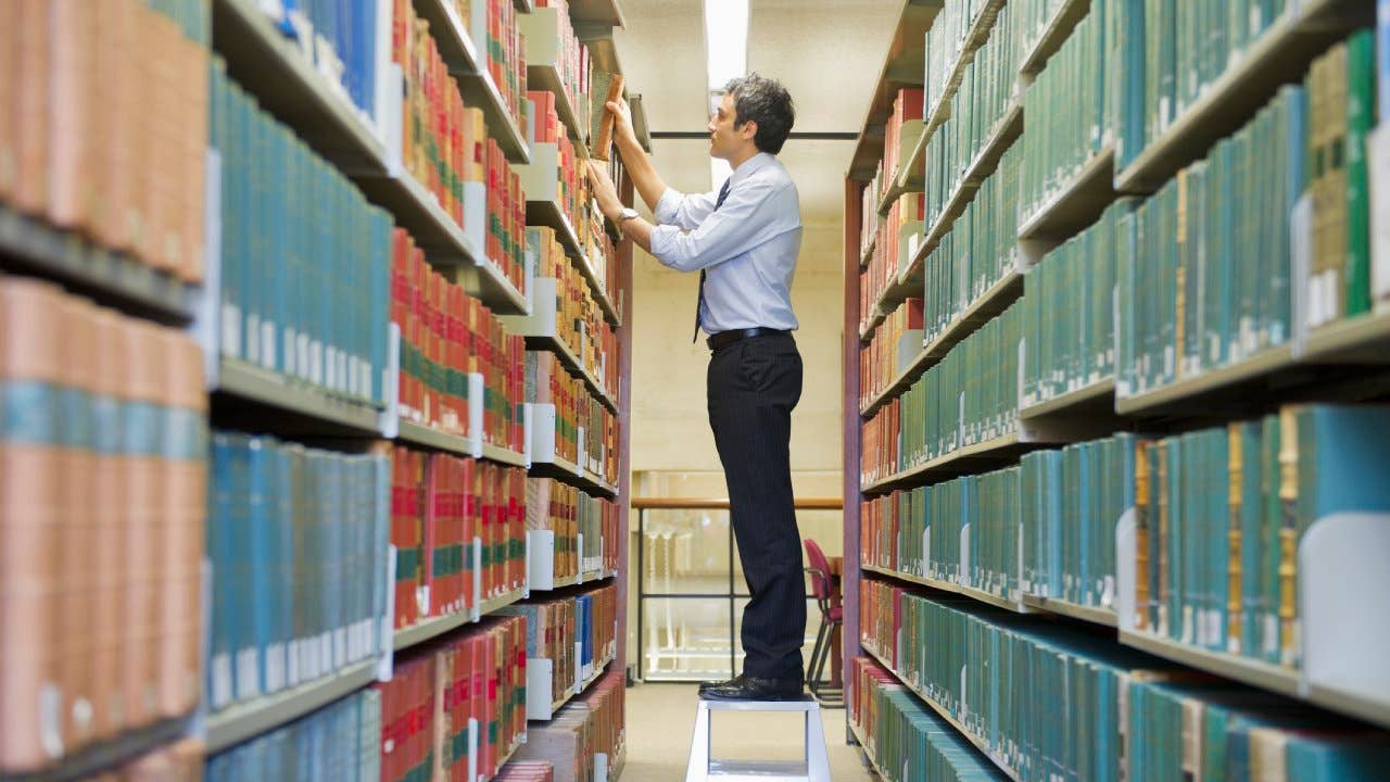 Person searching through a library of files