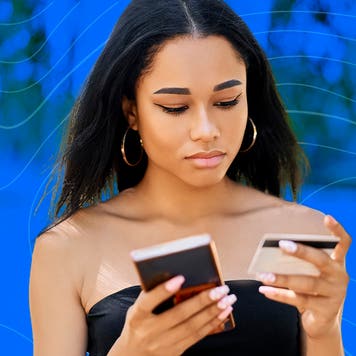 young person inserting card info into her phone