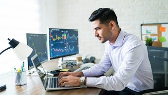 Man trading on computer