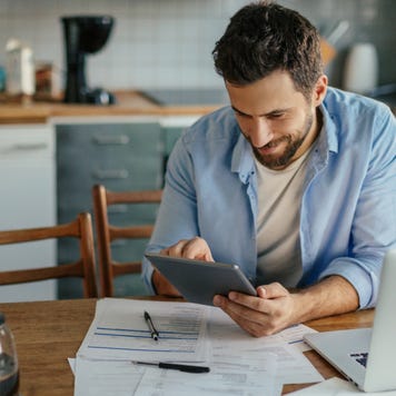 A man calculates his investment returns