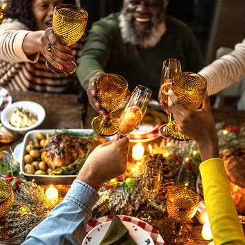 Family toasting on Christmas dinner at home