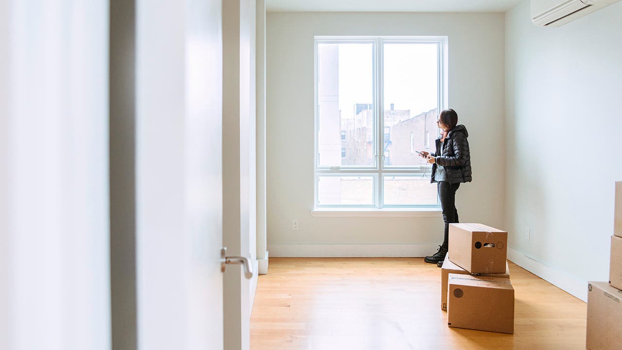 Teenager girls, sisters, looking around the new empty apartment