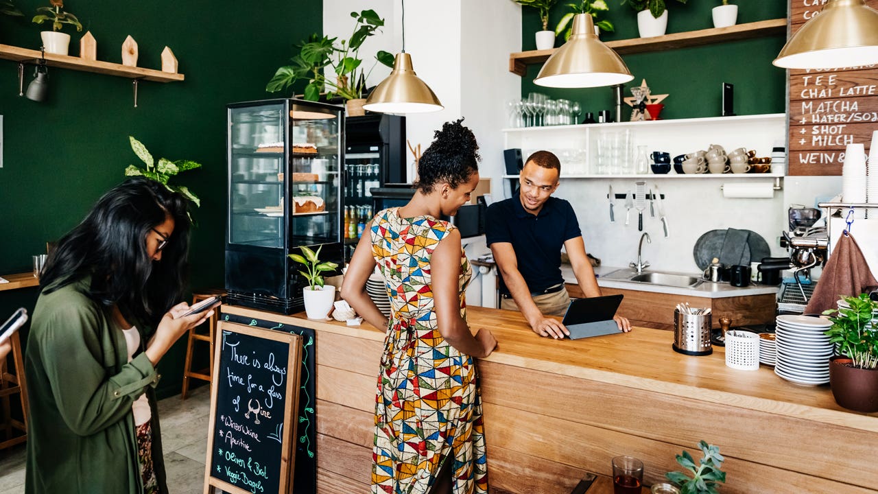 young person checking out a business