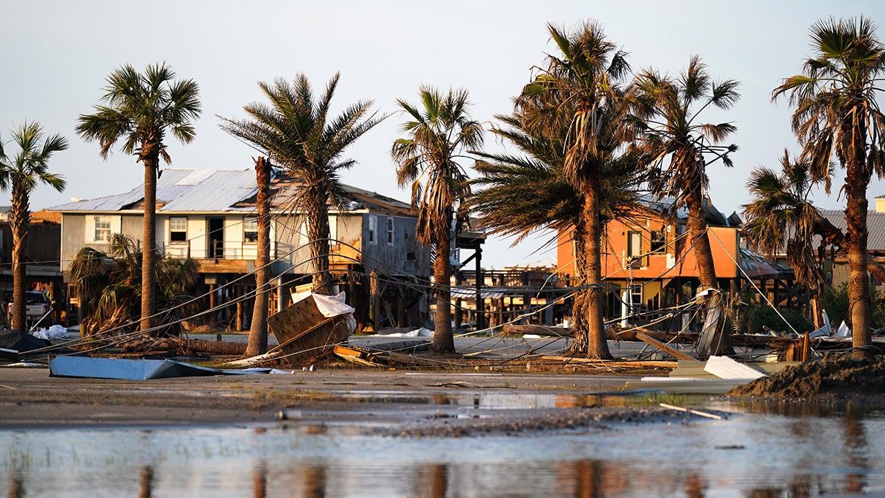 Storm debris litters a neighborhood in the wake of Hurricane Ida on September 3, 2021 in Grand Isle, Louisiana. Ida made landfall as a Category 4 hurricane five days before in Louisiana and brought flooding, wind damage and power outages along the Gulf Coast.
