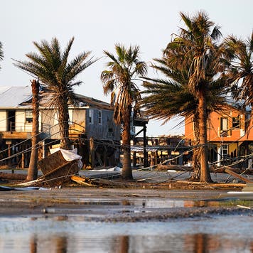 Storm debris litters a neighborhood in the wake of Hurricane Ida on September 3, 2021 in Grand Isle, Louisiana. Ida made landfall as a Category 4 hurricane five days before in Louisiana and brought flooding, wind damage and power outages along the Gulf Coast.