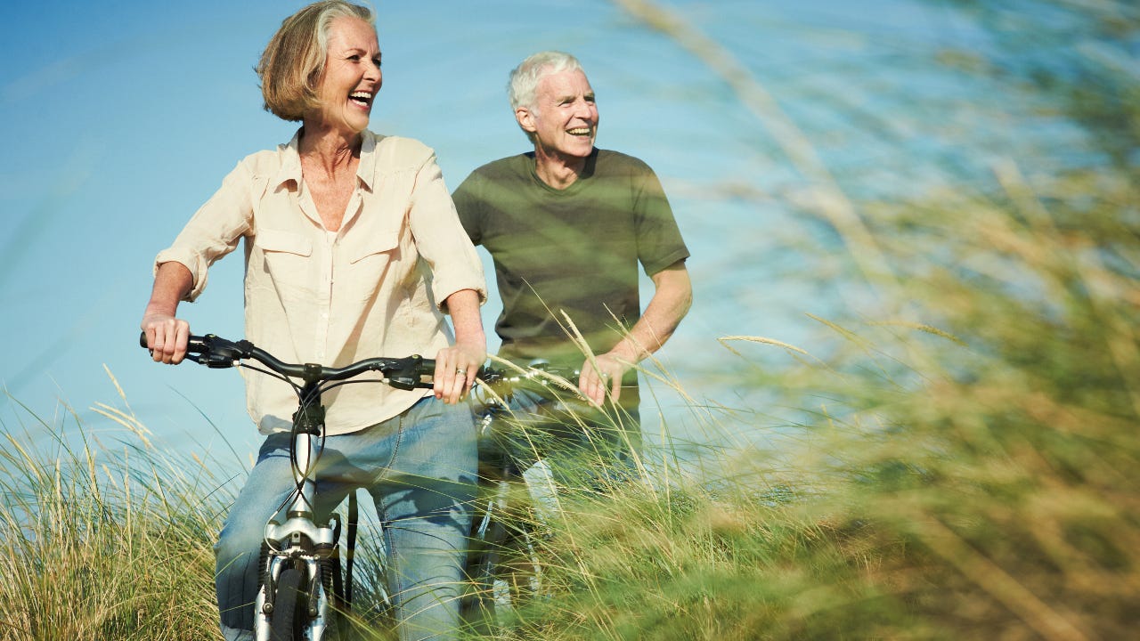 Retired couple riding bikes