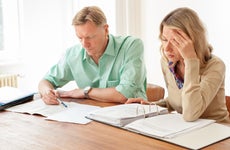 Two people reviewing paperwork