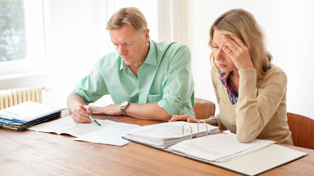 Two people reviewing paperwork