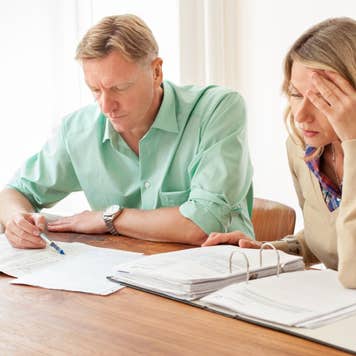 Two people reviewing paperwork
