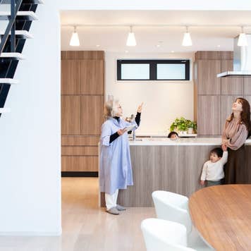 Three people looking around a house