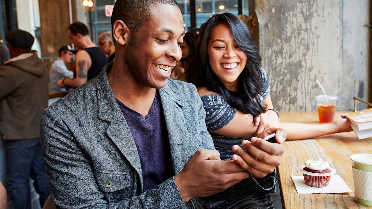 Young singles on a date at a coffee shop