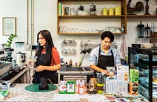 Female owners are working on small business cafe.