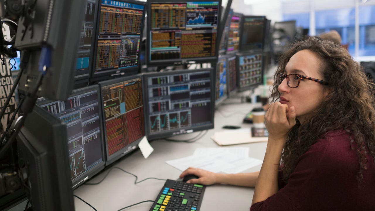 Young woman analyzing computer data