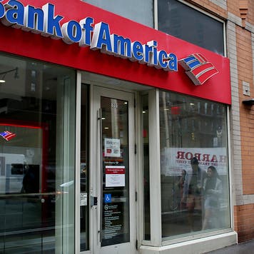 People walk near Bank of America branch, on July 18, 2022 in New York.