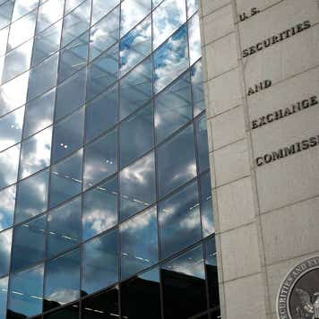 clouds reflecting in the windows of the SEC building