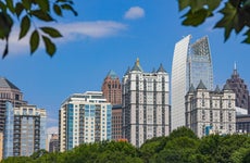 Skyscrapers in the midtown section of Atlanta, Georgia, surrounded by blue sky and greenery