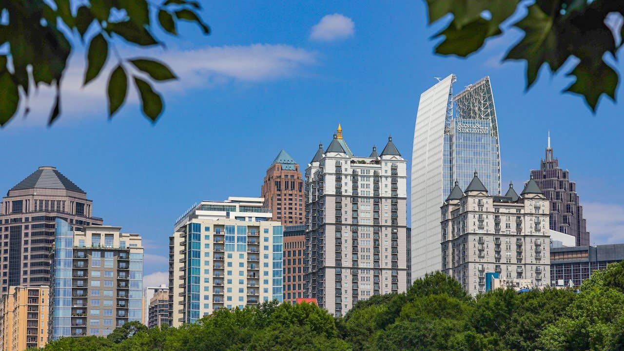 Skyscrapers in the midtown section of Atlanta, Georgia, surrounded by blue sky and greenery