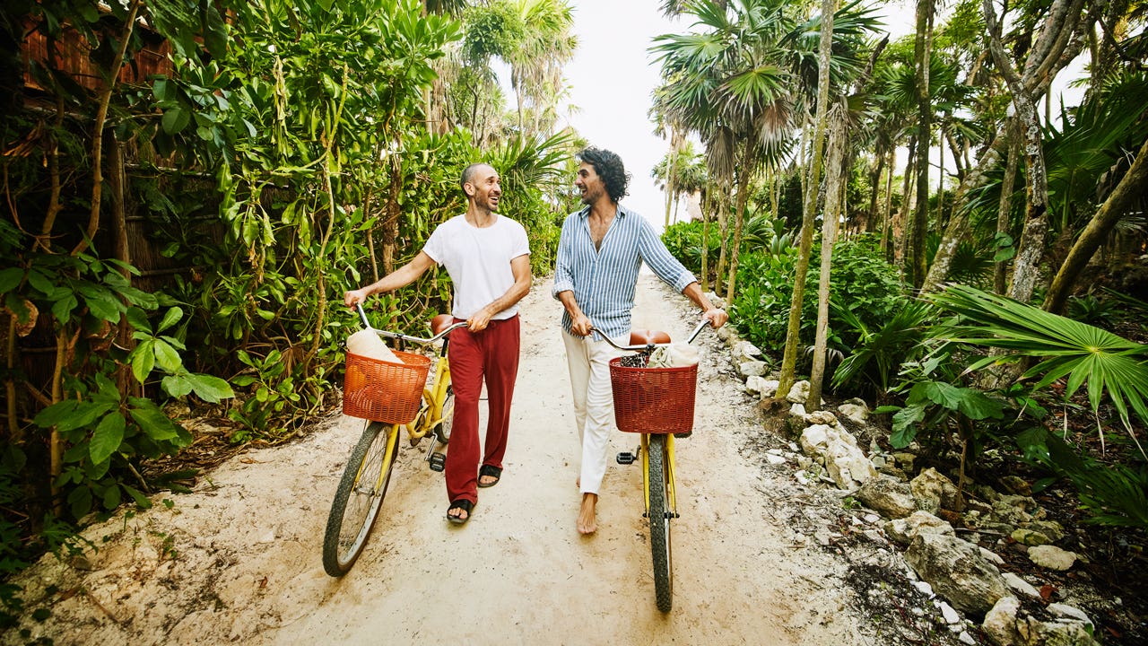 couple going for a walk with bikes