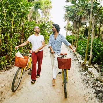couple going for a walk with bikes