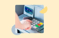 Hand touching buttons on a ATM keypad
