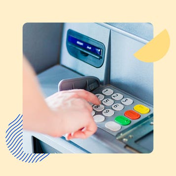 Hand touching buttons on a ATM keypad