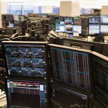 Trading floor with working computers