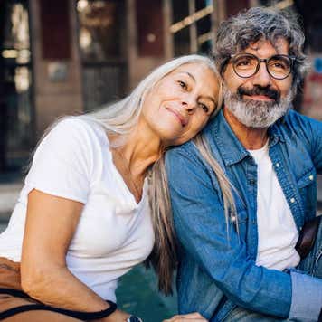 Portrait of a happy mature couple enjoying their romantic vacation in Barcelona