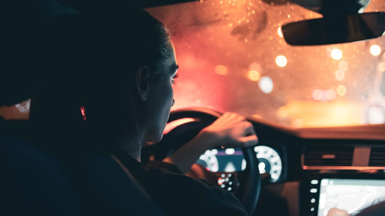 woman driving at night