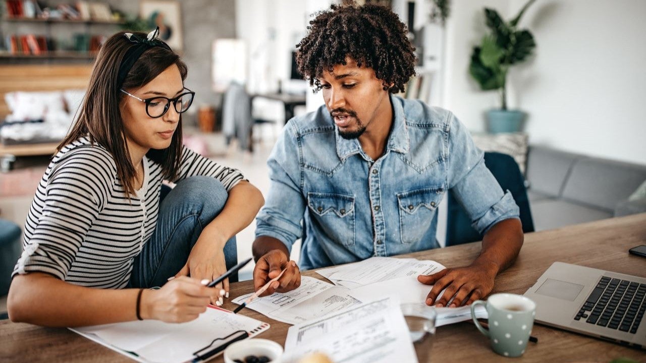Couple analyzing their family budget at a table