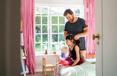 father doing daughters hair