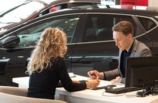female customer in car dealership